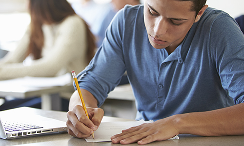 High School Students Taking Test In Classroom High School Students Taking Test In Classroom